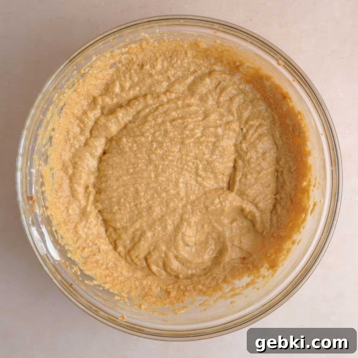 Simple Spiced Cake with Decadent Brown Butter Cream Cheese Frosting 6 Softened butter, brown sugar, eggs, vanilla extract, sour cream, and molasses creamed together in a bowl.