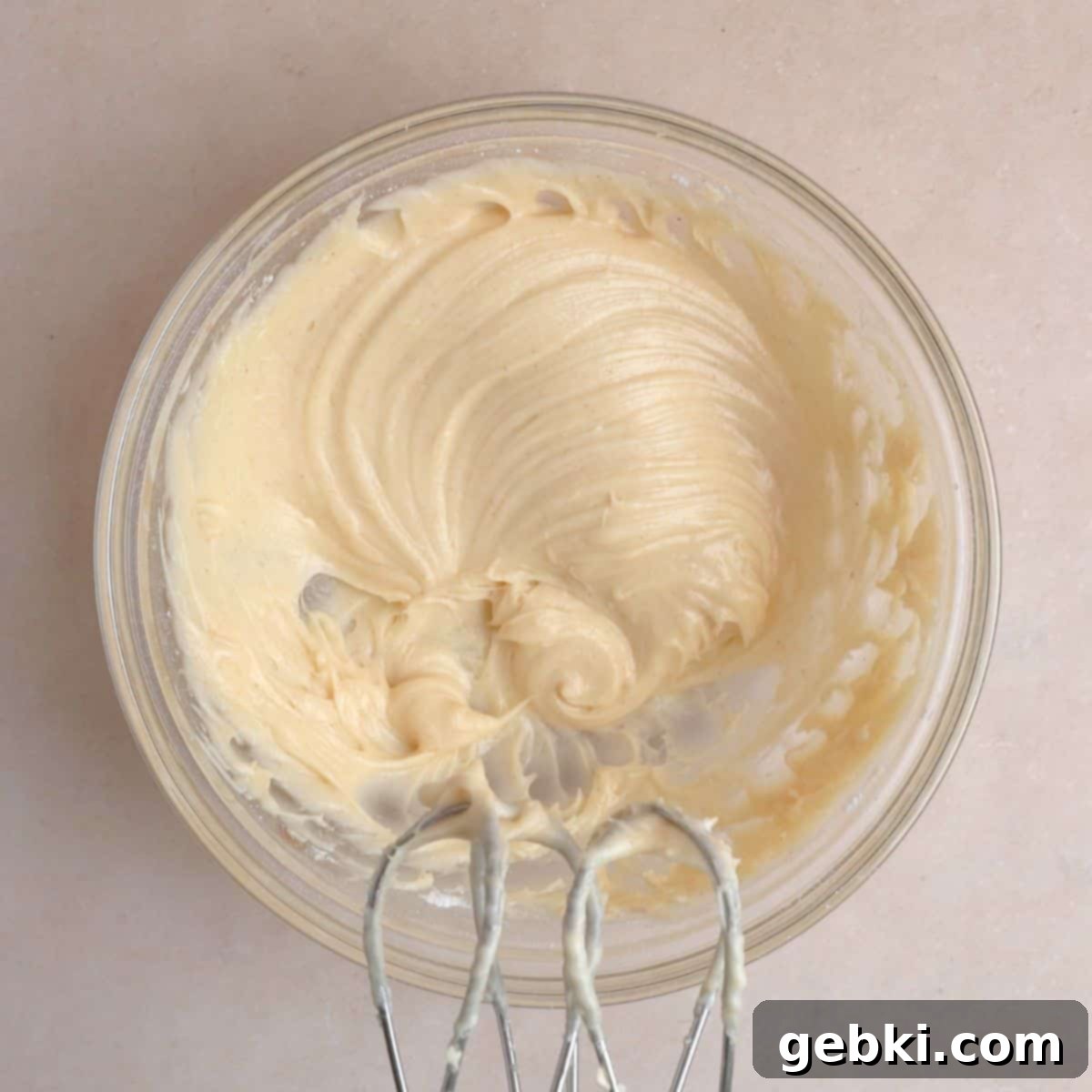 Simple Spiced Cake with Decadent Brown Butter Cream Cheese Frosting 9 Cream cheese mixed together with cooled brown butter, vanilla extract, and powdered sugar to create frosting.