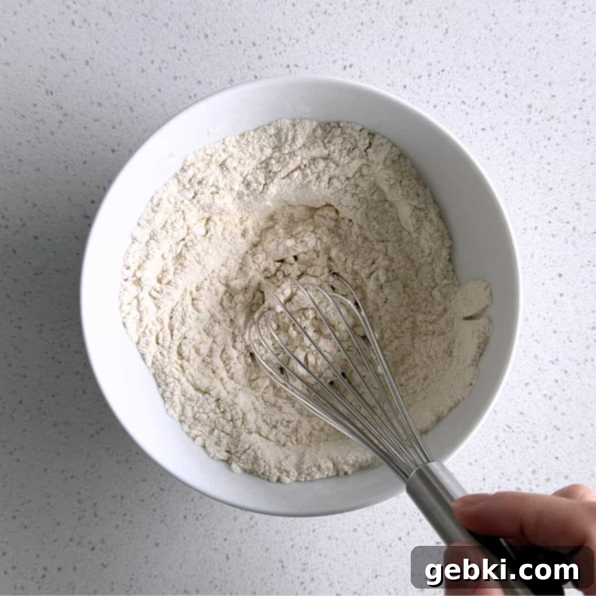 Mini Honey Muffins
Tiny Honey Bites of Joy 4 Flour, baking powder, cinnamon, and salt mixed together in a bowl, ready to be incorporated into the muffin batter.