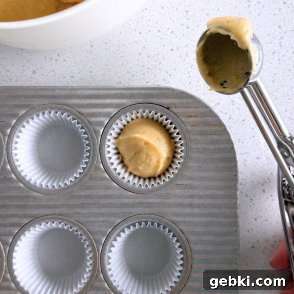 Mini Honey Muffins
Tiny Honey Bites of Joy 8 Scooping honey muffin batter into a mini muffin pan, ensuring even distribution for consistent baking.