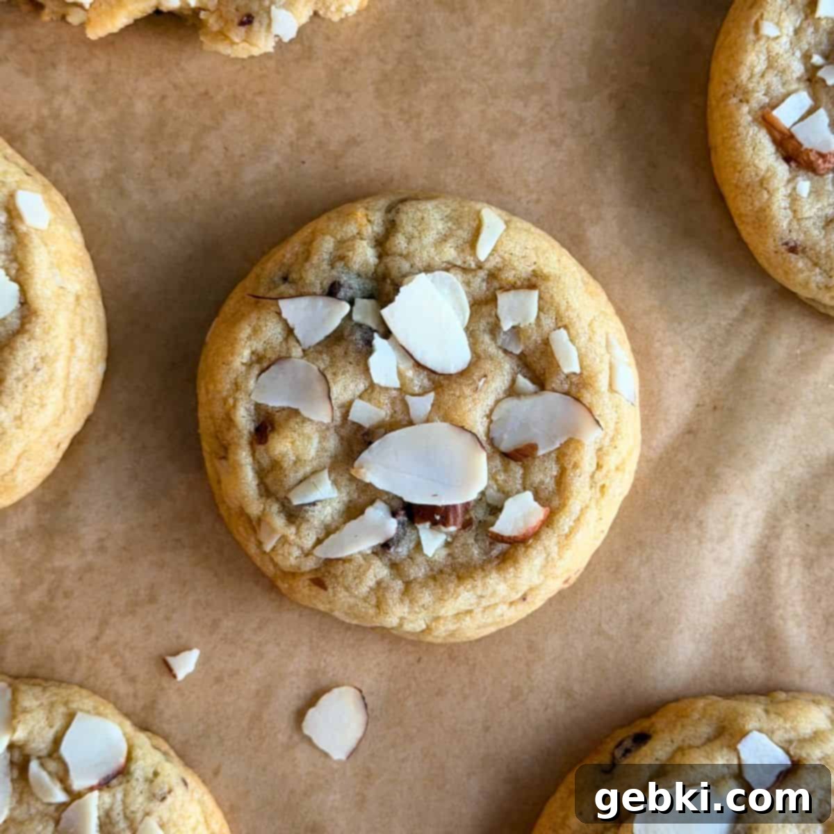 Orange Almond Chocolate Chunk Cookies 12 A beautifully baked orange almond chocolate chip cookie with visible sliced almonds on top.